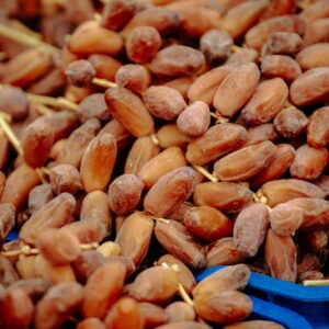Crates of golden-brown dry dates at market